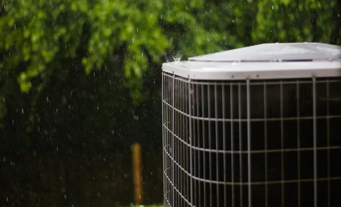 Air conditioning unit exposed to summer rain while a Melbourne home sits vacant